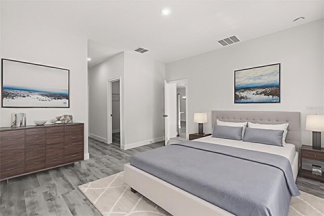 16057 SW 17th Ave, Ocala, FL 34473 - bedroom with light wood-type flooring and recessed lighting