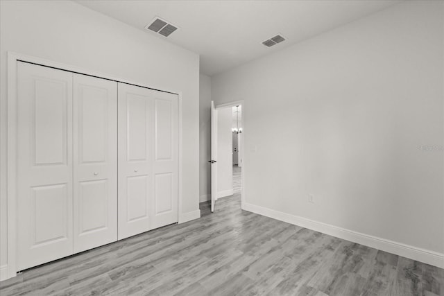 16057 SW 17th Ave, Ocala, FL 34473 - unfurnished bedroom with light wood finished floors and a closet