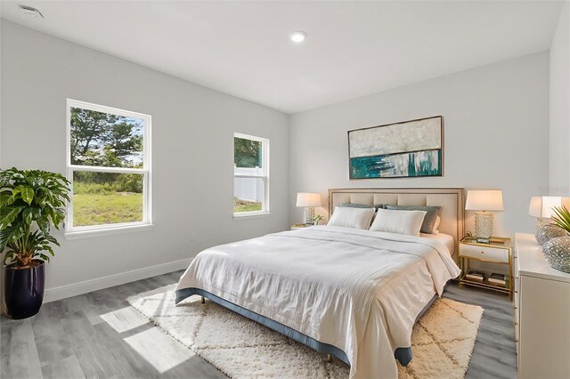 16057 SW 17th Ave, Ocala, FL 34473 - bedroom with wood finished floors and recessed lighting