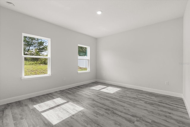 16057 SW 17th Ave, Ocala, FL 34473 - unfurnished room featuring wood finished floors and recessed lighting