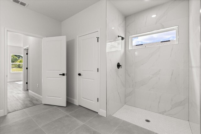 16057 SW 17th Ave, Ocala, FL 34473 - full bath with a marble finish shower and tile patterned floors