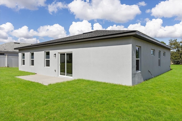 16057 SW 17th Ave, Ocala, FL 34473 - back of house with stucco siding, a patio area, and roof with shingles