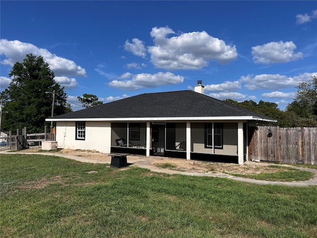 4805 SW 171st Ct, Dunnellon, FL 34432 - back of house with a sunroom, a chimney, roof with shingles, and stucco siding