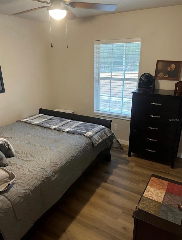 4805 SW 171st Ct, Dunnellon, FL 34432 - bedroom with wood finished floors and a ceiling fan