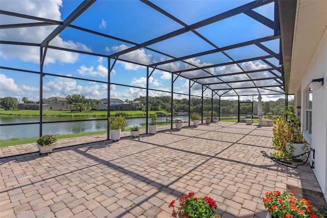 3774 Eagle Isle Cir, Kissimmee, FL 34746 - view of patio / terrace featuring a water view and glass enclosure