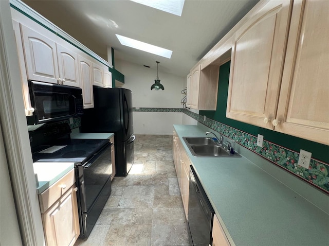 1082 S Fork Cir, Melbourne, FL 32901 - kitchen with black appliances, a skylight, lofted ceiling, stone finish flooring, and pendant lighting
