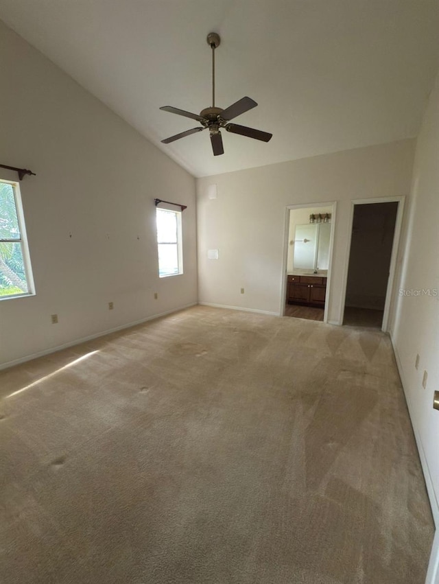 1082 S Fork Cir, Melbourne, FL 32901 - spare room with light carpet, ceiling fan, and vaulted ceiling