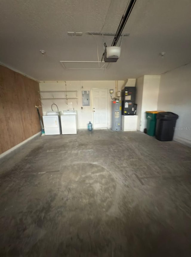 1082 S Fork Cir, Melbourne, FL 32901 - garage featuring washing machine and clothes dryer, water heater, heating unit, electric panel, and a garage door opener