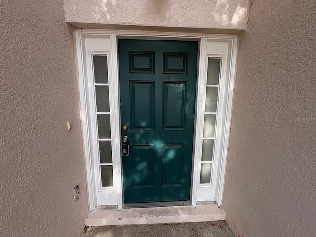 266 Vervain Ave, Davenport, FL 33837 - property entrance featuring stucco siding