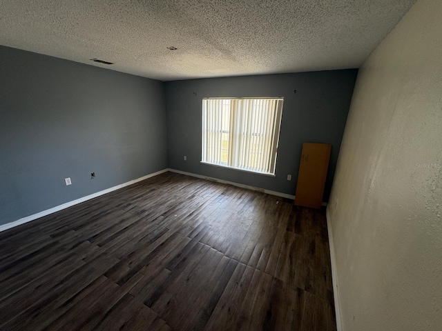 266 Vervain Ave, Davenport, FL 33837 - spare room with dark wood-type flooring and a textured ceiling