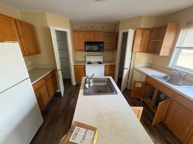 266 Vervain Ave, Davenport, FL 33837 - kitchen featuring white appliances, open shelves, dark wood-style flooring, and a textured ceiling