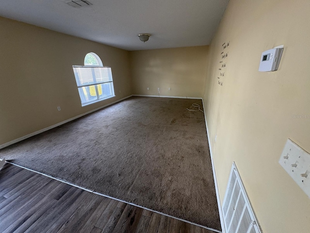 266 Vervain Ave, Davenport, FL 33837 - carpeted spare room featuring baseboards and wood finished floors