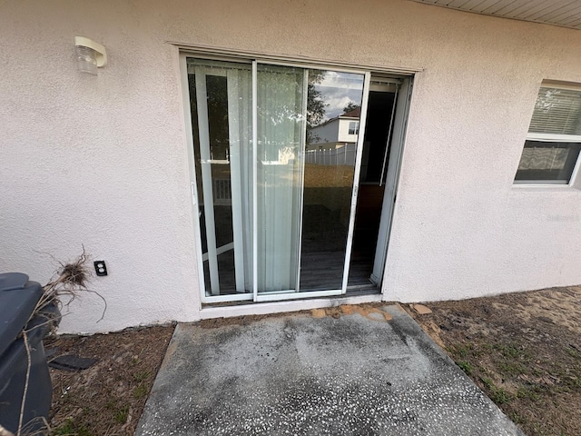 266 Vervain Ave, Davenport, FL 33837 - entrance to property featuring stucco siding
