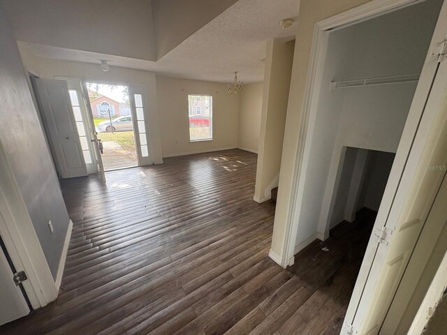 266 Vervain Ave, Davenport, FL 33837 - foyer entrance featuring a chandelier, wood finished floors, and a textured ceiling