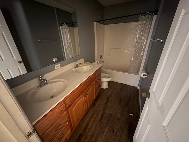 266 Vervain Ave, Davenport, FL 33837 - full bathroom with double vanity, wood finished floors, and shower / tub combo with curtain