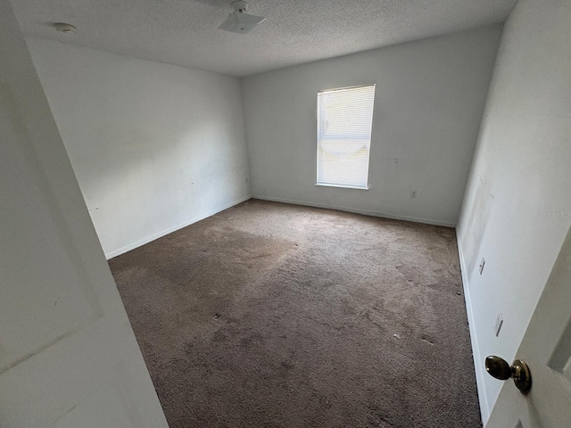 266 Vervain Ave, Davenport, FL 33837 - unfurnished room with carpet flooring, a smoke detector, and a textured ceiling