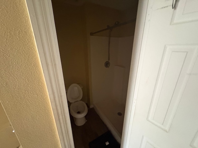 266 Vervain Ave, Davenport, FL 33837 - full bathroom featuring a shower stall and a textured wall