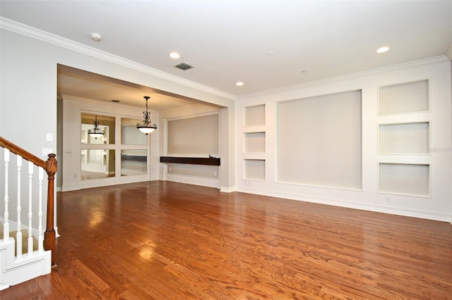 1649 Lake Baldwin Ln, Orlando, FL 32814 - unfurnished living room featuring built in shelves, ornamental molding, stairs, wood finished floors, and a chandelier