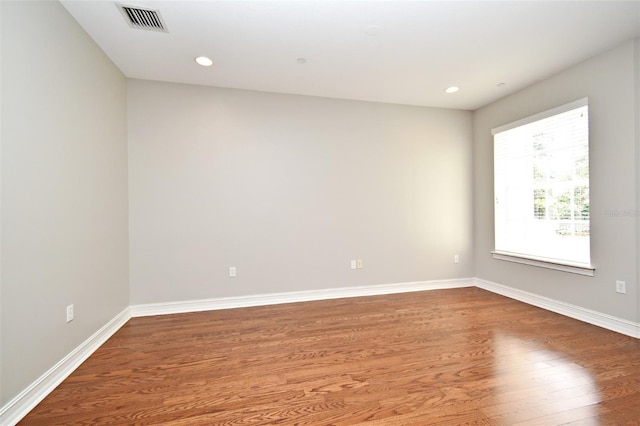 1649 Lake Baldwin Ln, Orlando, FL 32814 - unfurnished room with wood finished floors and recessed lighting