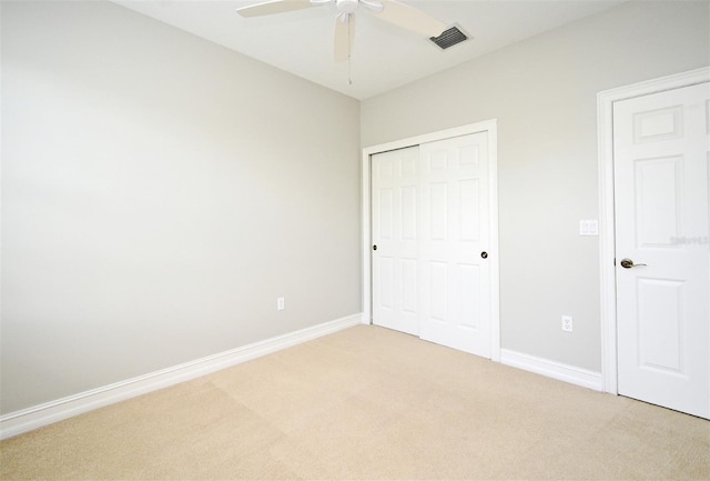 1649 Lake Baldwin Ln, Orlando, FL 32814 - unfurnished bedroom with light carpet, a closet, and ceiling fan