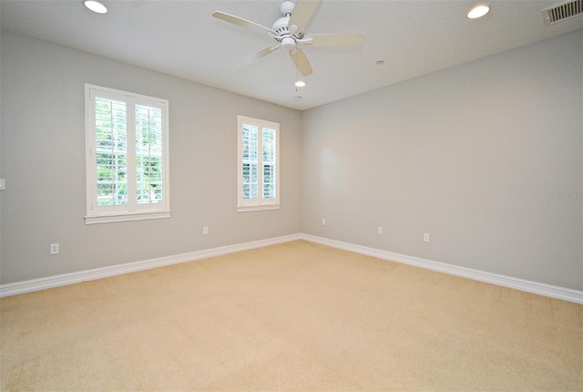 1649 Lake Baldwin Ln, Orlando, FL 32814 - unfurnished room with light carpet, recessed lighting, and ceiling fan