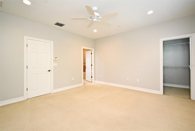 1649 Lake Baldwin Ln, Orlando, FL 32814 - unfurnished bedroom with light carpet, recessed lighting, a spacious closet, ceiling fan, and a closet