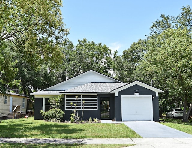 1502 W 16 Th St, Sanford, FL 32771 - view of front of property with a garage, roof with shingles, and concrete driveway