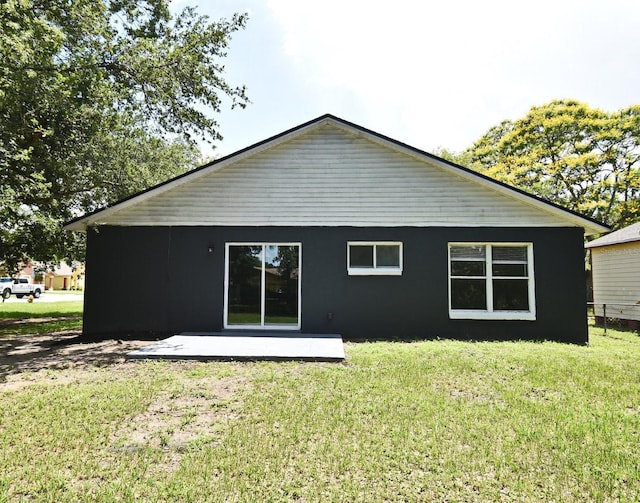 1502 W 16 Th St, Sanford, FL 32771 - back of house with a lawn and stucco siding