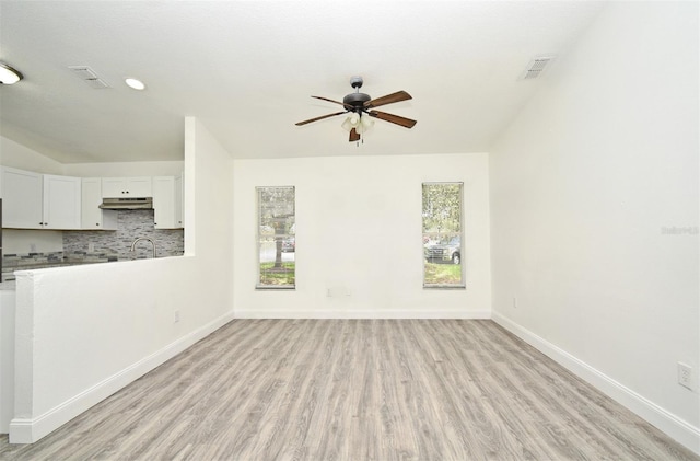 1502 W 16 Th St, Sanford, FL 32771 - unfurnished living room with a ceiling fan, light wood-style floors, and recessed lighting