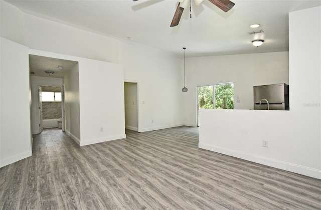 1502 W 16 Th St, Sanford, FL 32771 - unfurnished living room featuring ceiling fan and wood finished floors