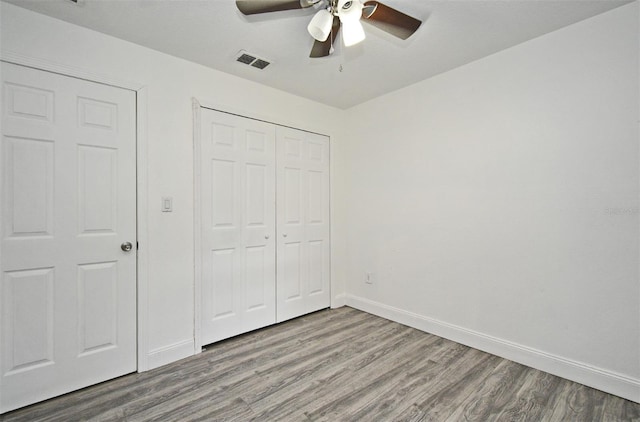 1502 W 16 Th St, Sanford, FL 32771 - unfurnished bedroom featuring wood finished floors, a closet, and a ceiling fan