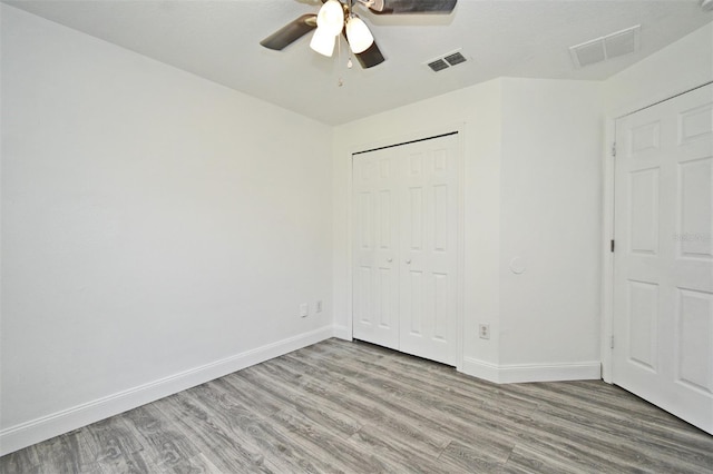 1502 W 16 Th St, Sanford, FL 32771 - unfurnished bedroom featuring wood finished floors, a closet, and a ceiling fan