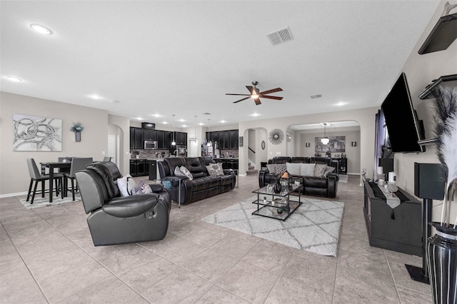 1270 Fountain Coin Loop, Orlando, FL 32828 - living room with arched walkways, ceiling fan, recessed lighting, and light tile patterned floors
