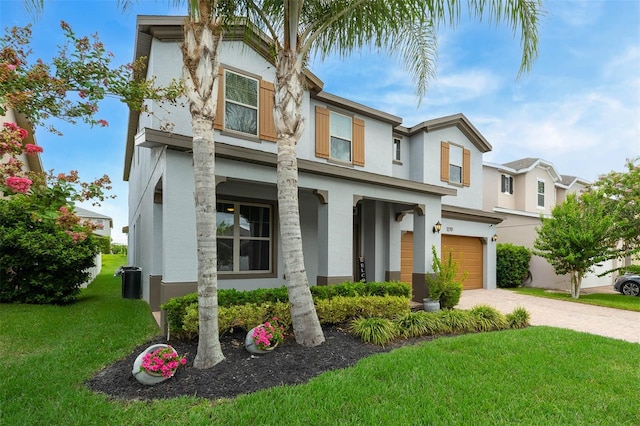 1270 Fountain Coin Loop, Orlando, FL 32828 - view of front of property featuring stucco siding, a garage, a front lawn, decorative driveway, and covered porch