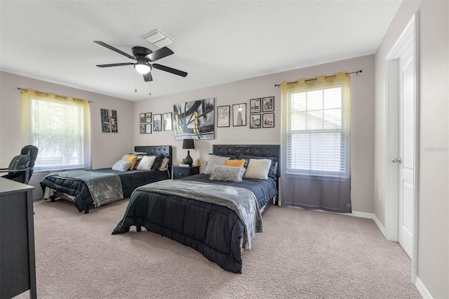1270 Fountain Coin Loop, Orlando, FL 32828 - bedroom with multiple windows, carpet floors, and a ceiling fan
