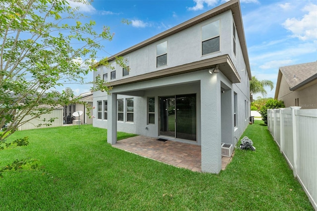 1270 Fountain Coin Loop, Orlando, FL 32828 - rear view of house with stucco siding and a patio