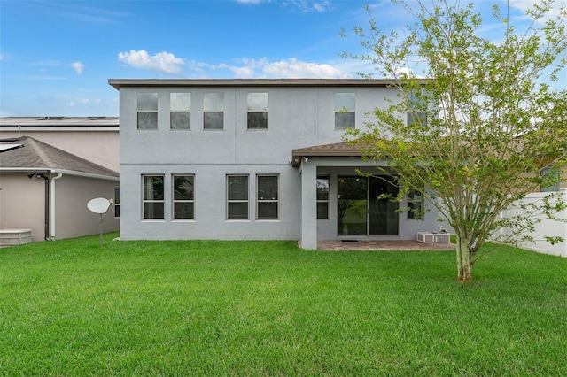 1270 Fountain Coin Loop, Orlando, FL 32828 - rear view of property with stucco siding and a yard
