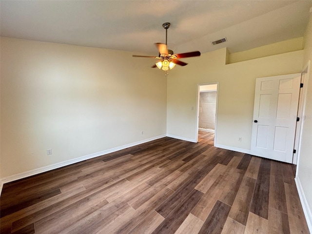 3055 Kirkland St, Deltona, FL 32738 - unfurnished bedroom with dark wood finished floors, a ceiling fan, and vaulted ceiling