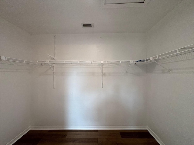 3055 Kirkland St, Deltona, FL 32738 - spacious closet with dark wood-style floors and attic access