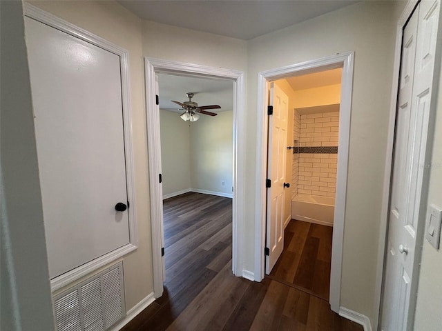 3055 Kirkland St, Deltona, FL 32738 - corridor featuring dark wood finished floors and baseboards