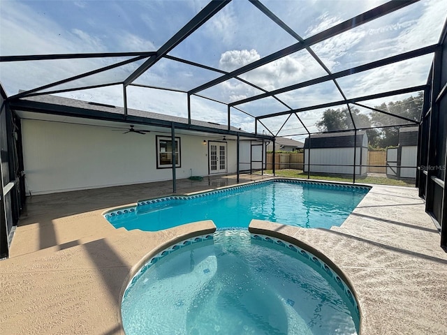 3055 Kirkland St, Deltona, FL 32738 - view of pool with french doors, a storage shed, a patio area, a ceiling fan, and a pool with connected hot tub