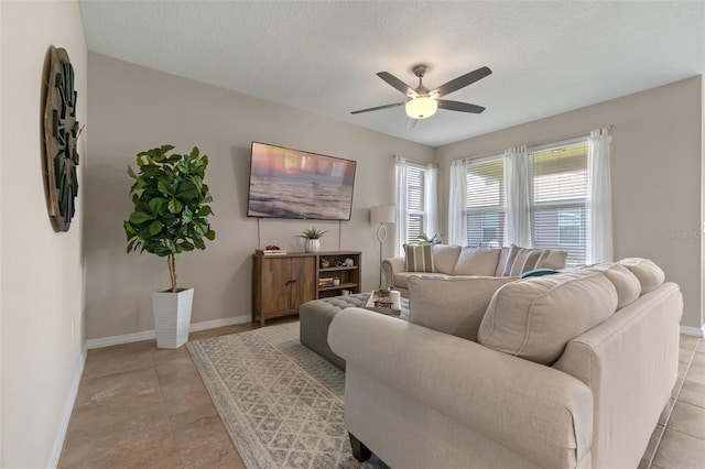 1958 Commander Way, Kissimmee, FL 34746 - living area featuring ceiling fan, a textured ceiling, and light tile patterned floors