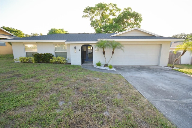 628 Riverview Ave, Altamonte Springs, FL 32714 - single story home featuring a garage, stucco siding, concrete driveway, and a front lawn