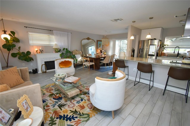 628 Riverview Ave, Altamonte Springs, FL 32714 - living area featuring a fireplace and light wood finished floors
