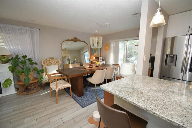 628 Riverview Ave, Altamonte Springs, FL 32714 - dining area with light wood-style floors