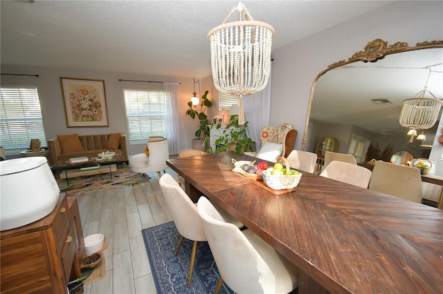 628 Riverview Ave, Altamonte Springs, FL 32714 - dining room with a chandelier and a textured ceiling