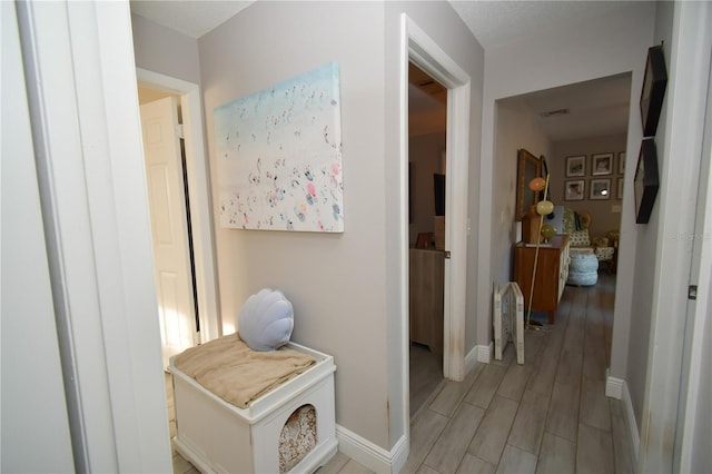 628 Riverview Ave, Altamonte Springs, FL 32714 - hall with baseboards and light wood finished floors