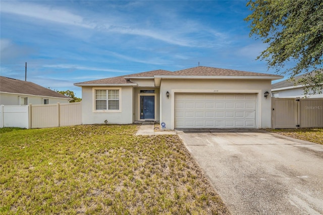 209 Grouper Ct, Poinciana, FL 34759 - view of front facade with stucco siding, a garage, concrete driveway, and a shingled roof