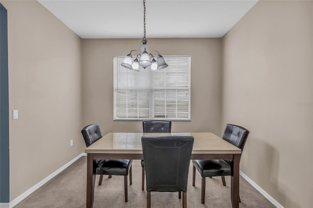 209 Grouper Ct, Poinciana, FL 34759 - carpeted dining room featuring a chandelier and baseboards