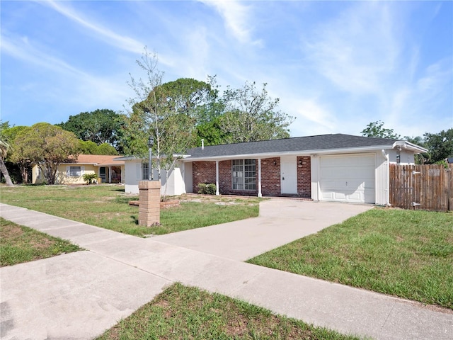 1432 Findlay St, Deltona, FL 32725 - ranch-style house featuring a garage, concrete driveway, and brick siding
